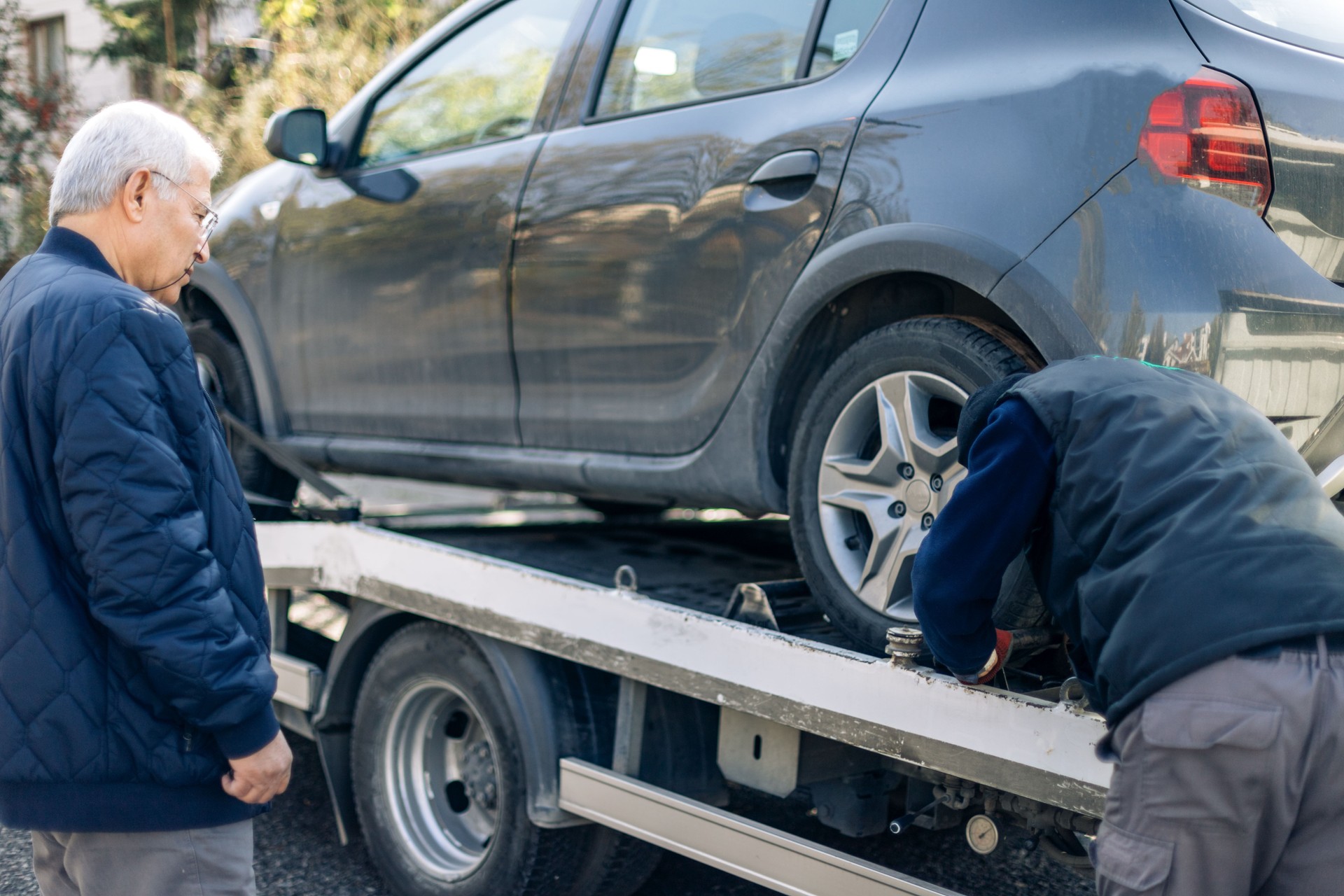 Car loaded onto tow truck