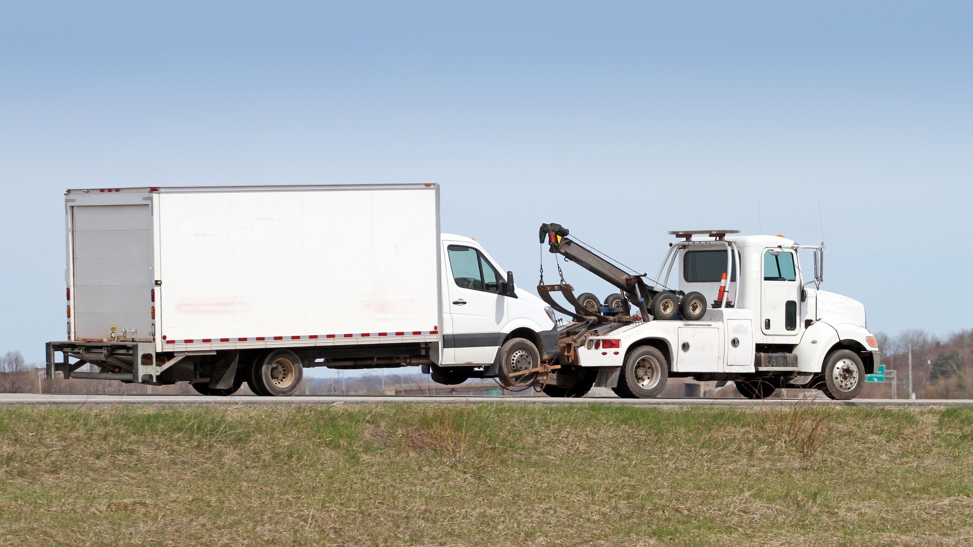 Tow Truck Towing A Truck On Highway